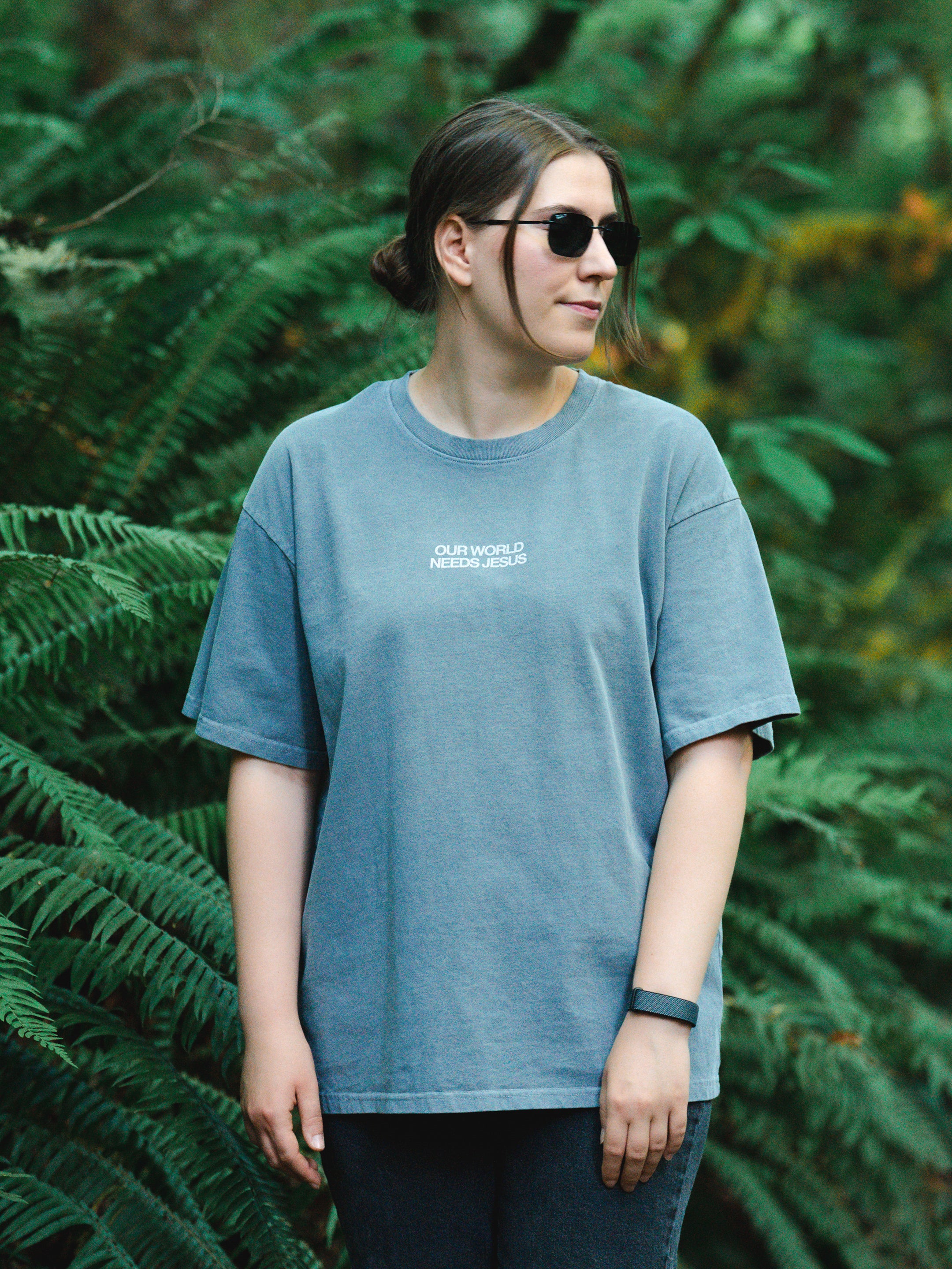 OUR WORLD NEEDS JESUS UNISEX TEE